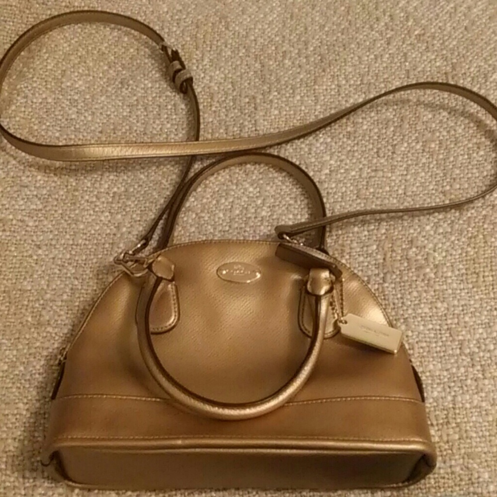 Coach dome-shaped gold purse